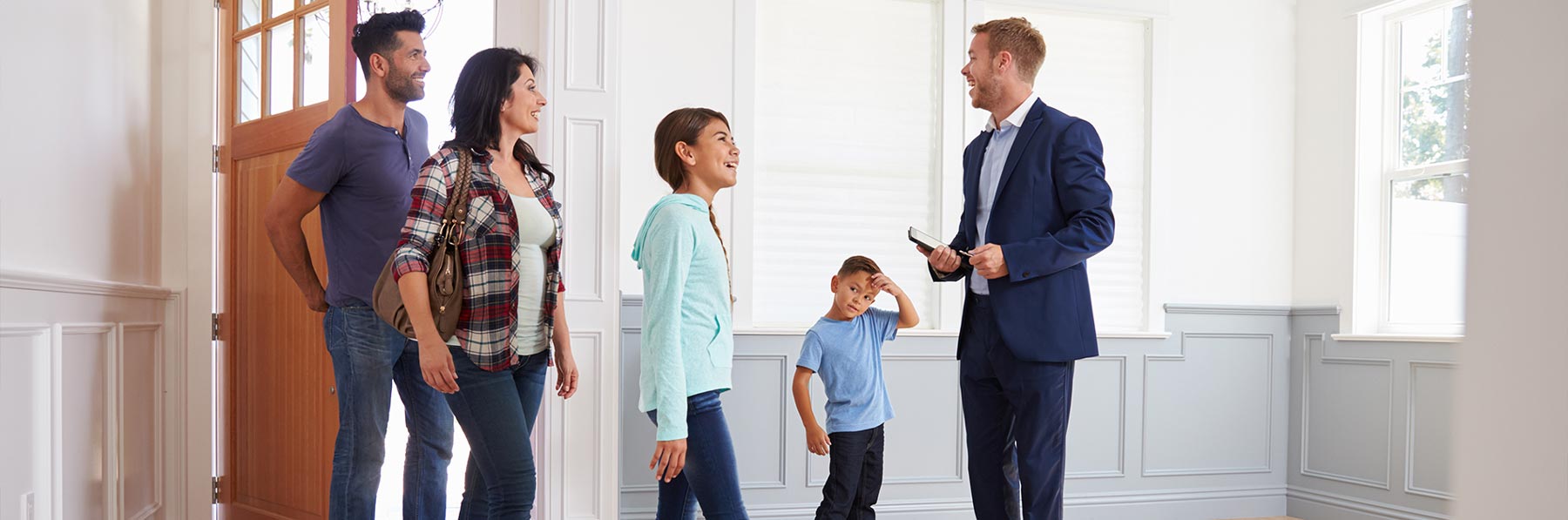 Family touring a home with Your Home Sold Guaranteed Realty.